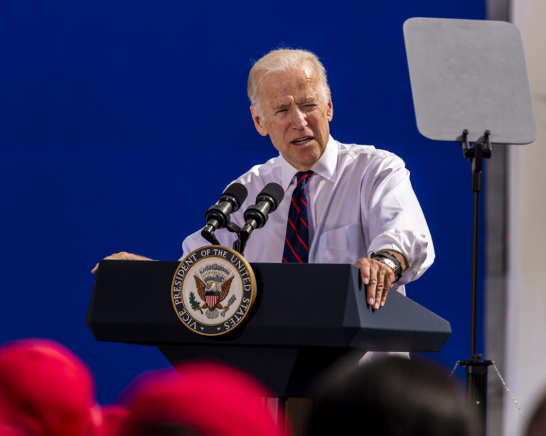 President Joe Biden standing at podium