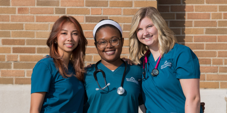 Three nurses posing for photo