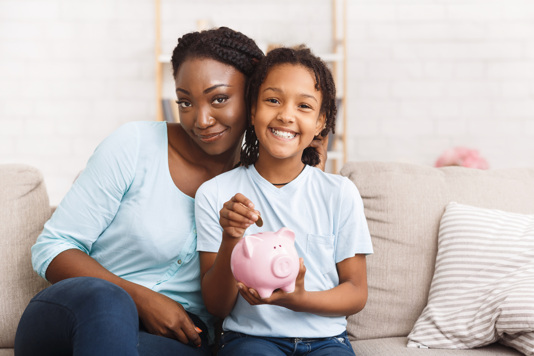 Mom and Daughter with Piggy Bank